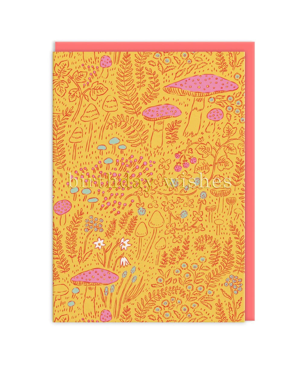 Card with a colorful mushroom and nature pattern on a yellow background and the text ‘Birthday Wishes’, with a pink envelope.