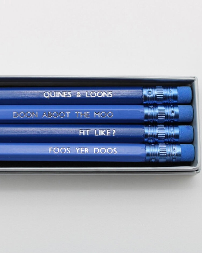 Set of blue pencils with Doric words text in a box, words'Quines & Loons' visible on one pencil