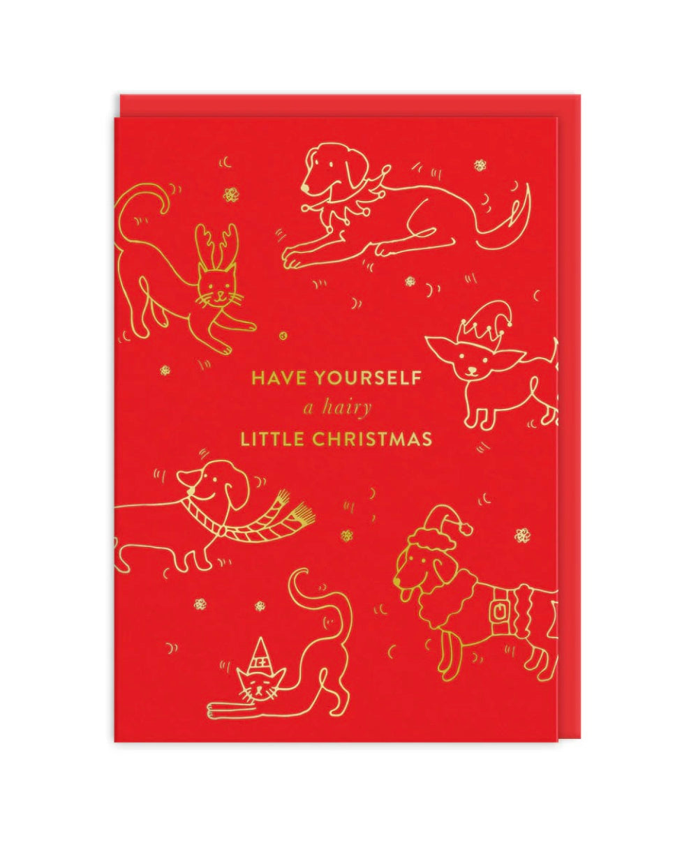 Red card with gold line drawings of cats and dogs and Christmas-themed text,on a white background.