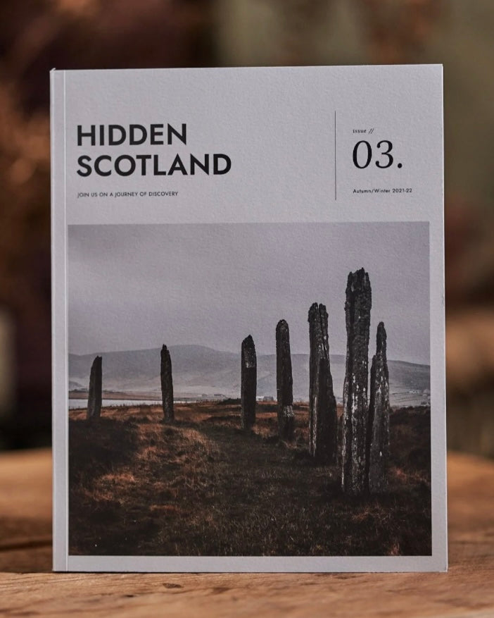 Magazine titled 'Hidden Scotland' Issue 3 with a cover photo of stone structures on a grassy field.