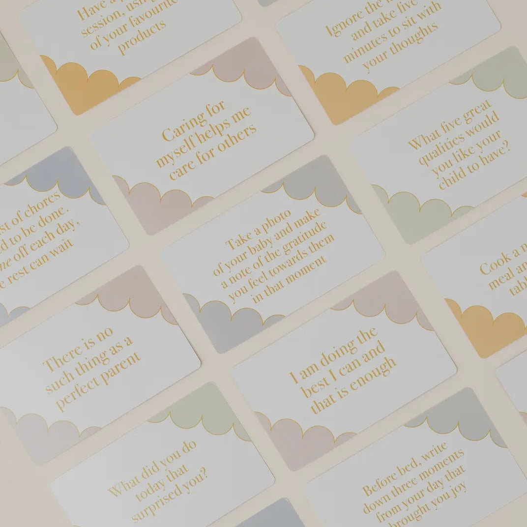 Set of motivational cards for new parents with yellow text, on a light background.