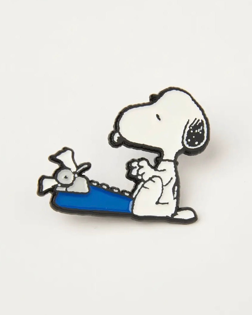 Snoopy pin with a blue ty on a white backgroundewriter