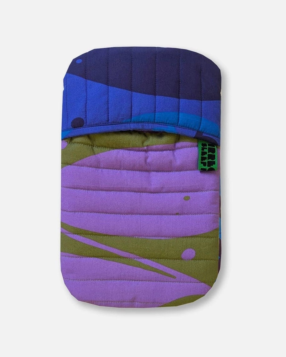 Colourful quilted phone case with purple, green, and blue design on a white background