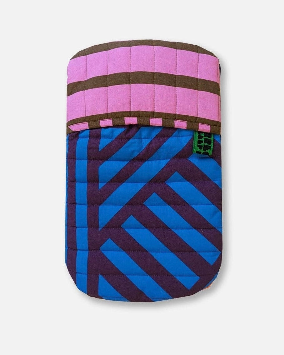 Colourful hot water bottle cover on a white background