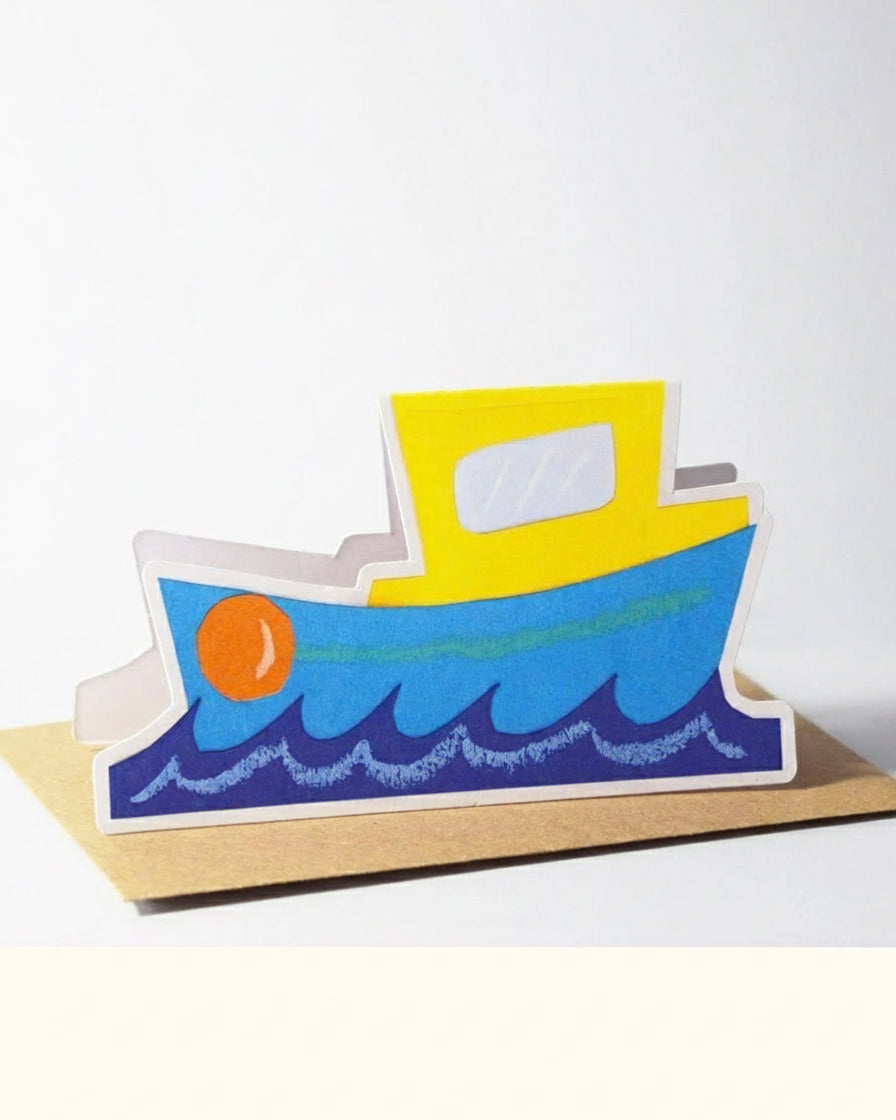 Colourful boat-shaped card on a white background