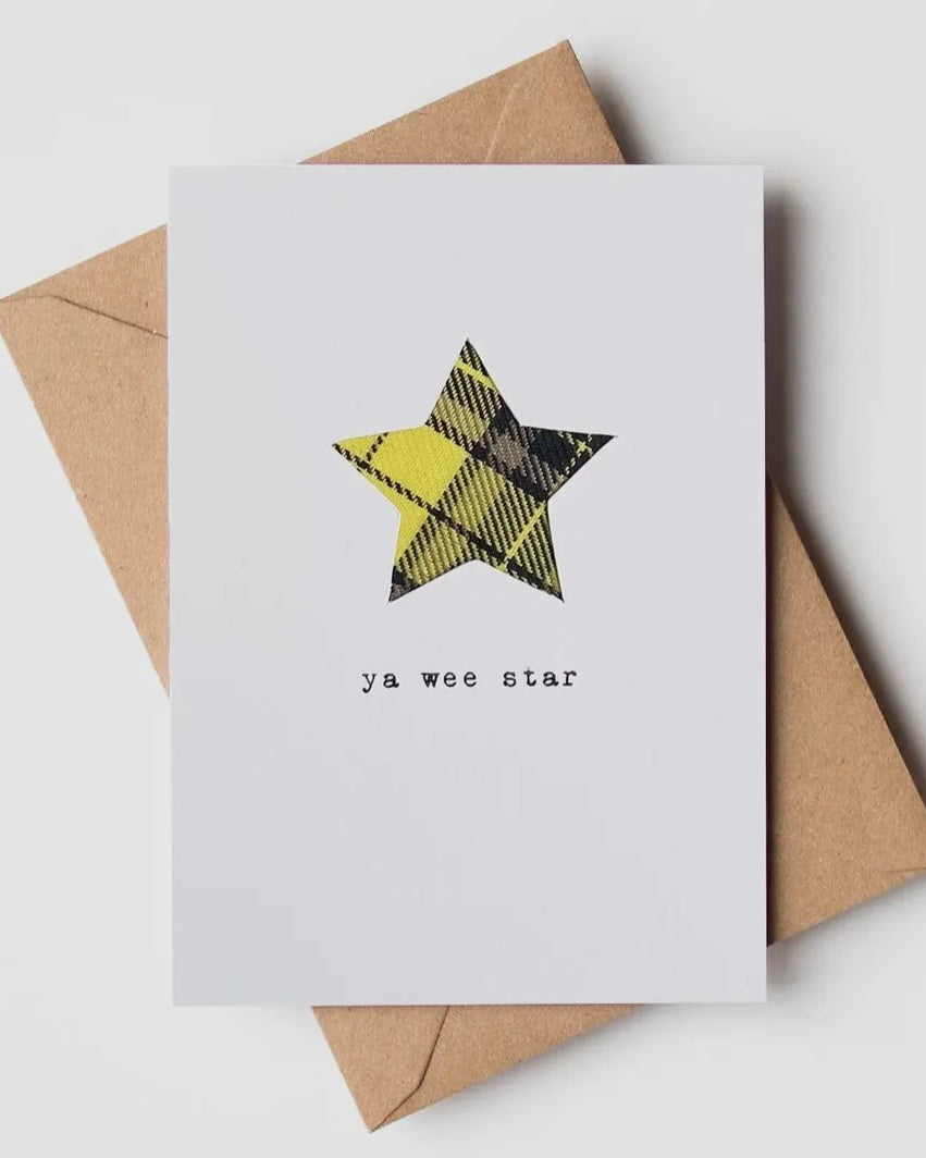 White card with real tartan star shape inset, on a brown envelope