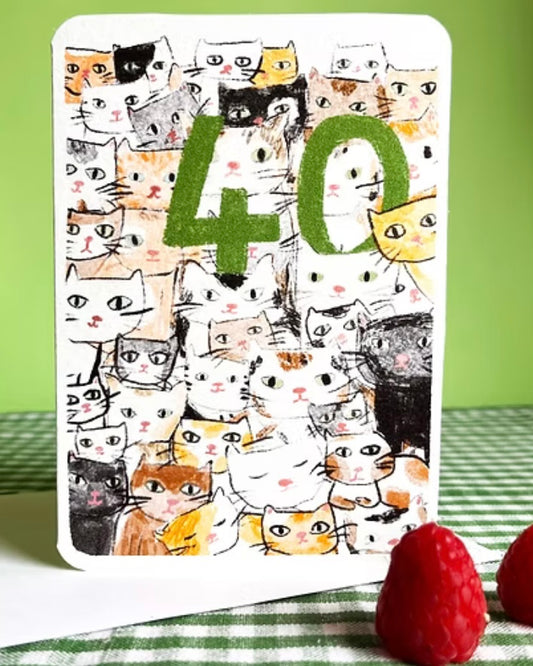 Card with green number 40 surrounded by cat illustrations on a green background