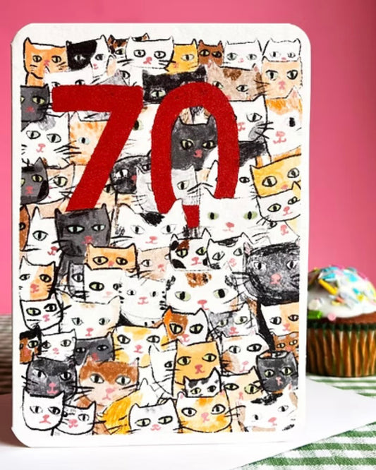 Card with cat pattern and red number 70 on a pink background