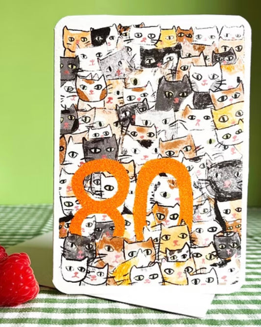 Greeting card with cat pattern and orange number 80.