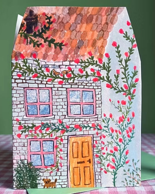 Shaped card with a house design, with flowers and a cat on an envelope.