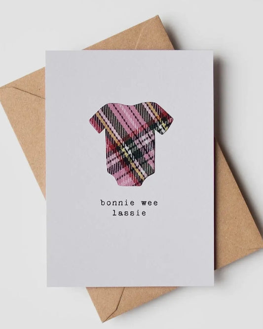 White card with real pink tartan cloth insert, with the words Bonnie wee lassie, on a brown envelope