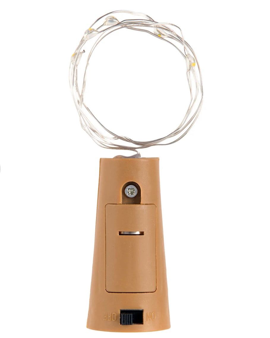 Beige bottle top with LED string light on a white background