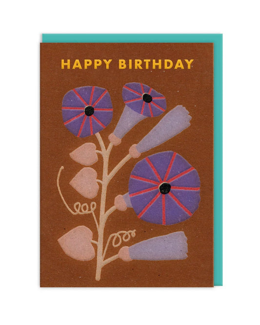 Greeting card with floral design and 'Happy Birthday' text on a brown background