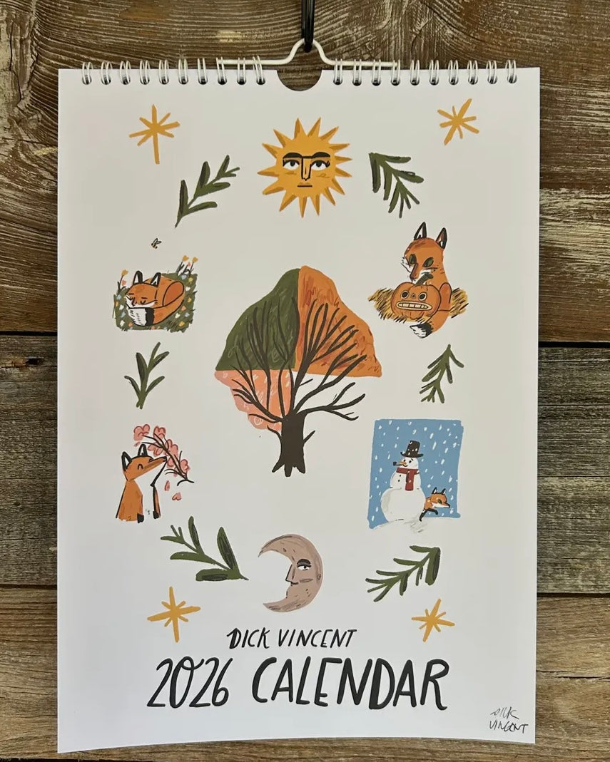2026 calendar with nature-themed illustrations on a wooden background