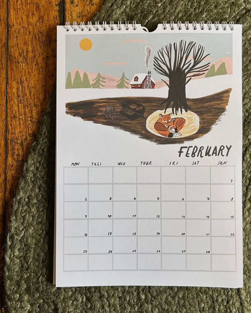 Calendar page with February illustration on a textured surface