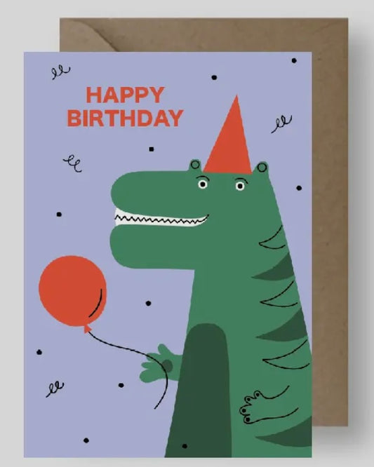 Birthday card with a green dinosaur holding a red balloon and a party hat on a purple background.