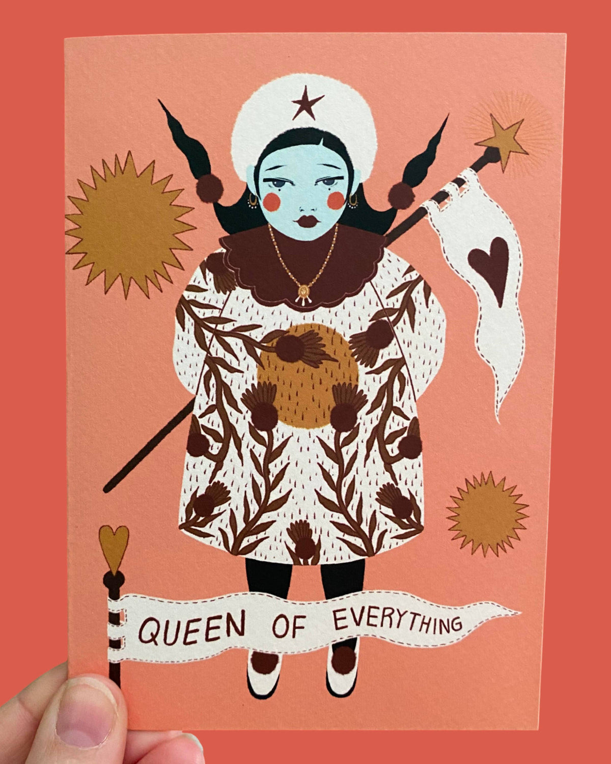 Illustration of a woman with a banner 'Queen of Everything' on a peach background