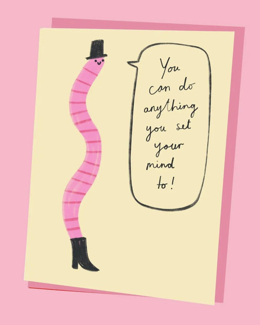 Motivational card with a pink worm character and text on a yellow background