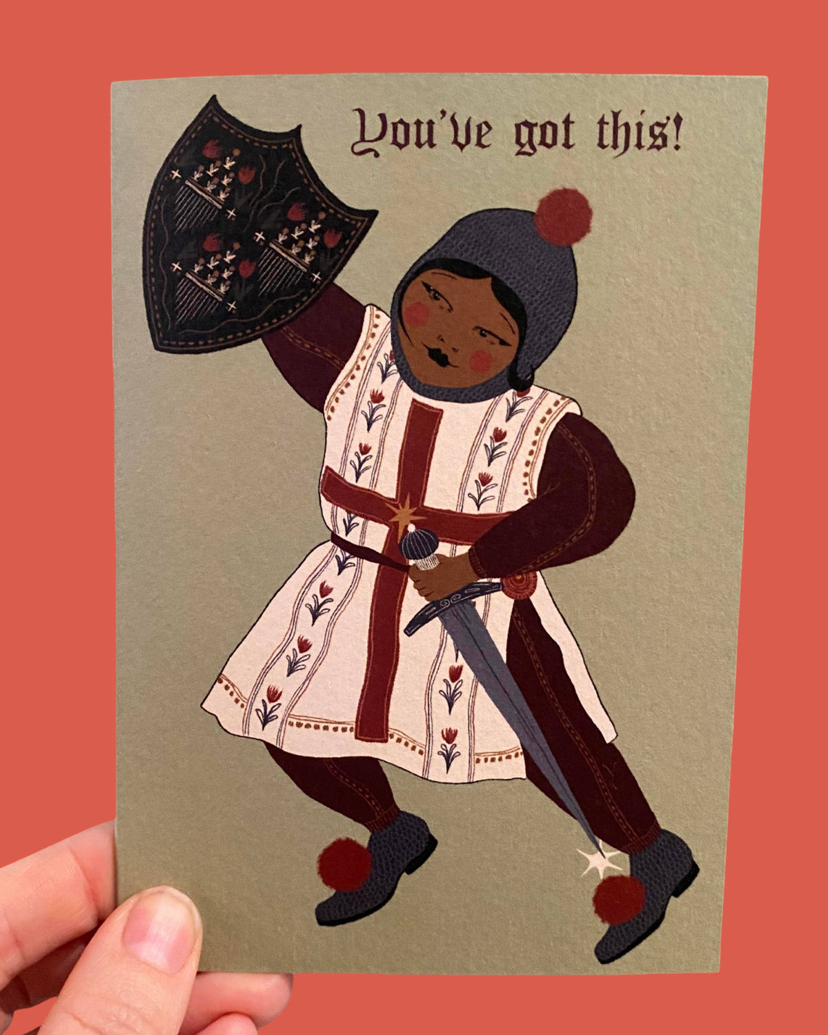 Card with illustration of a character in medieval attire holding a sword and shield, with text 'You've got this!' on a red background.