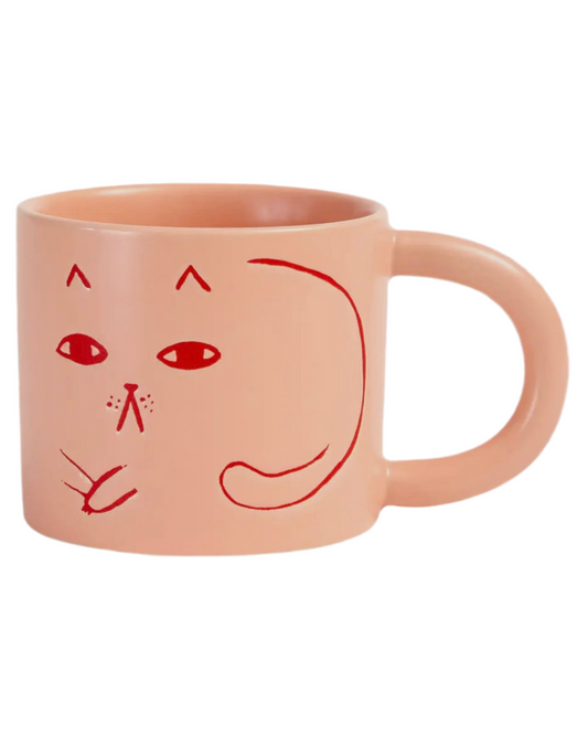 Pink mug with abstract cat design, in a white background.
