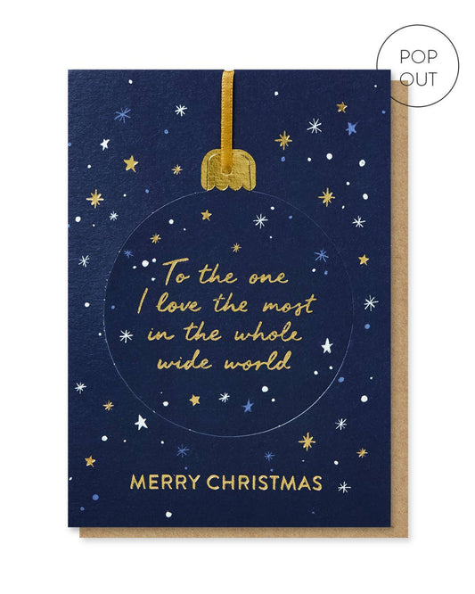 Christmas card with gold ornament and festive text on a blue background