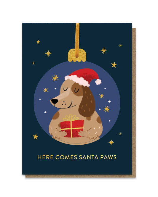 Christmas card with a dog wearing a Santa hat holding a gift, against a starry night background.