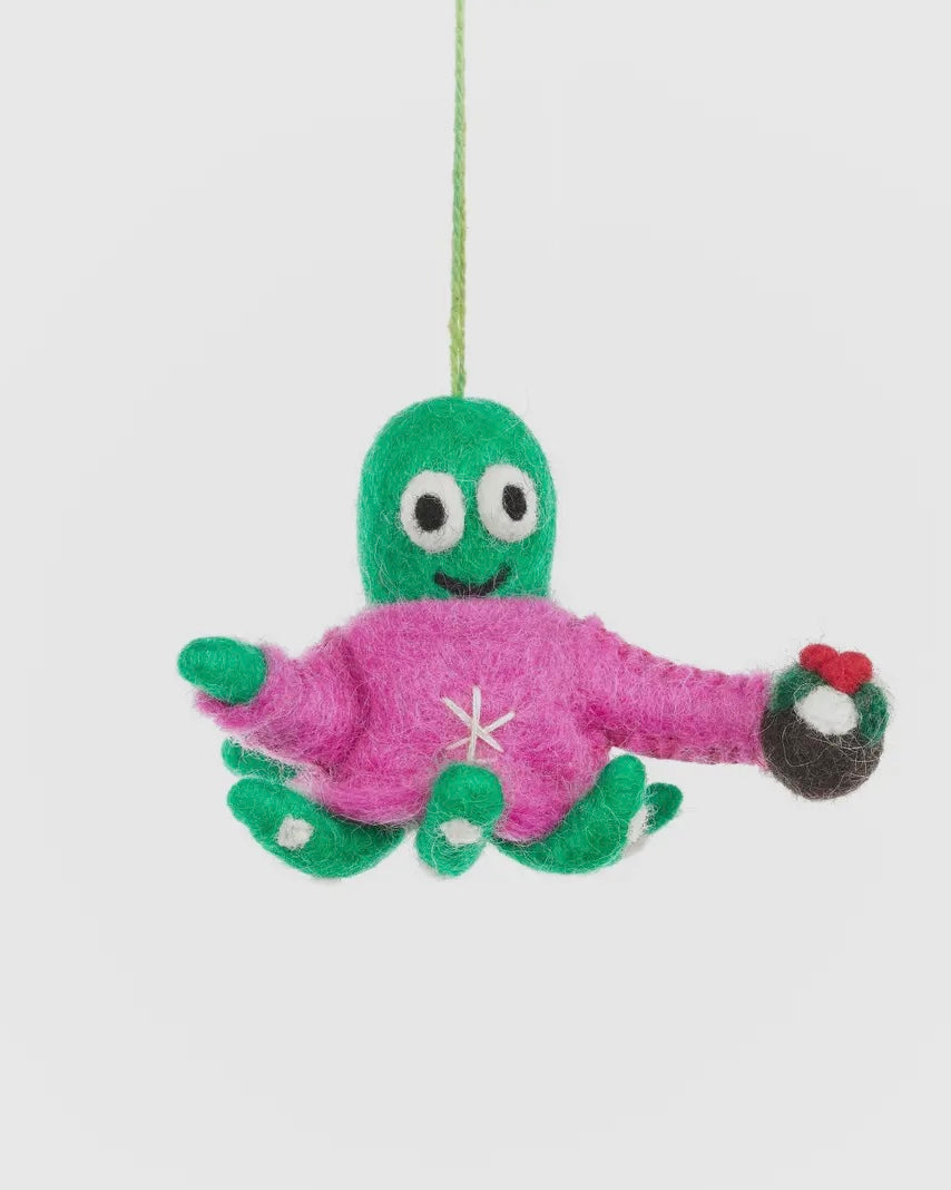 Green and pink plush octopus toy decoration hanging on a white background