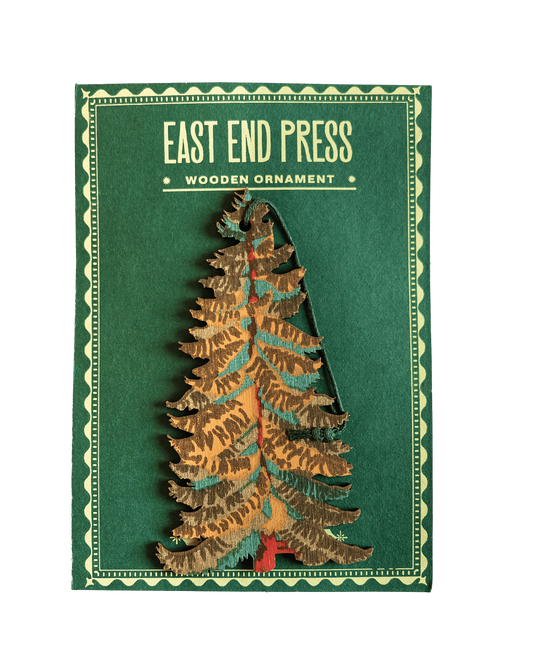 Wooden Christmas tree ornament with 'East End Press' branding on a green background