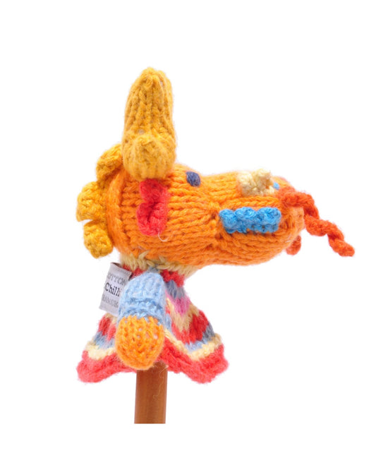 Knitted dragon finger puppet toy with a colourful jumper, on a white background