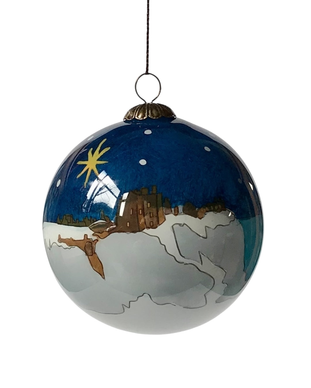 A handpainted glass bauble with a snowy night-time Dunnottar Castle scene, featuring a star in the sky and snow-covered ground.