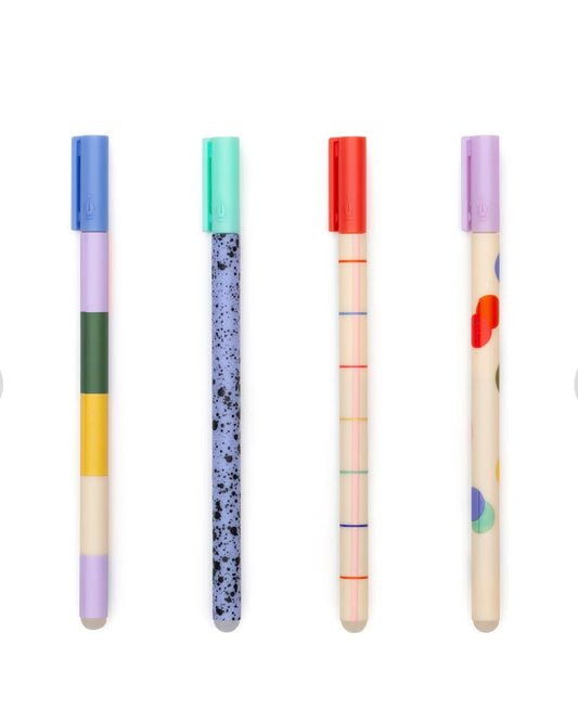 Set of four colourful pens with lids on a white background