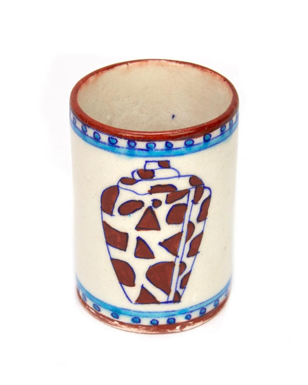 Ceramic tumbler with decorative brown and blue patterns and shell design, on a white background