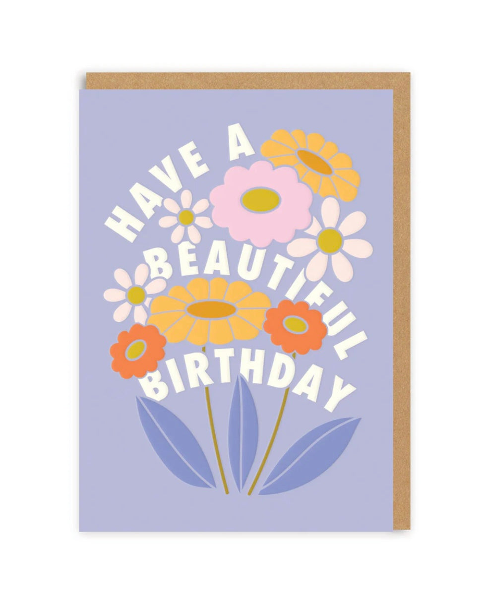 Greeting card with colorful flowers and 'Have a Beautiful Birthday' text on a light purple background.