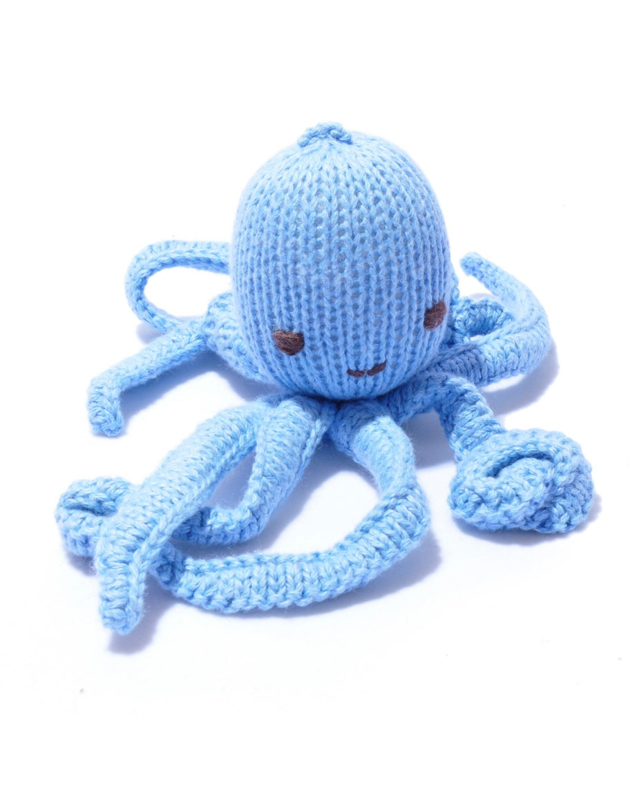 Blue knitted octopus toy on a white background