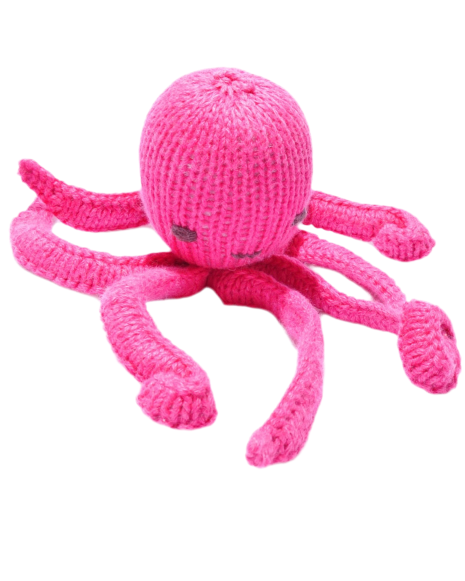 Pink knitted octopus toy on a white background
