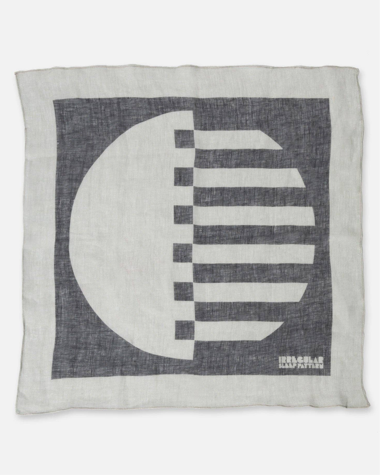 Decorative linen napkin / scarf with black & white geometric design on a white background