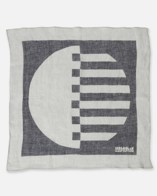 Decorative linen napkin / scarf with black & white geometric design on a white background