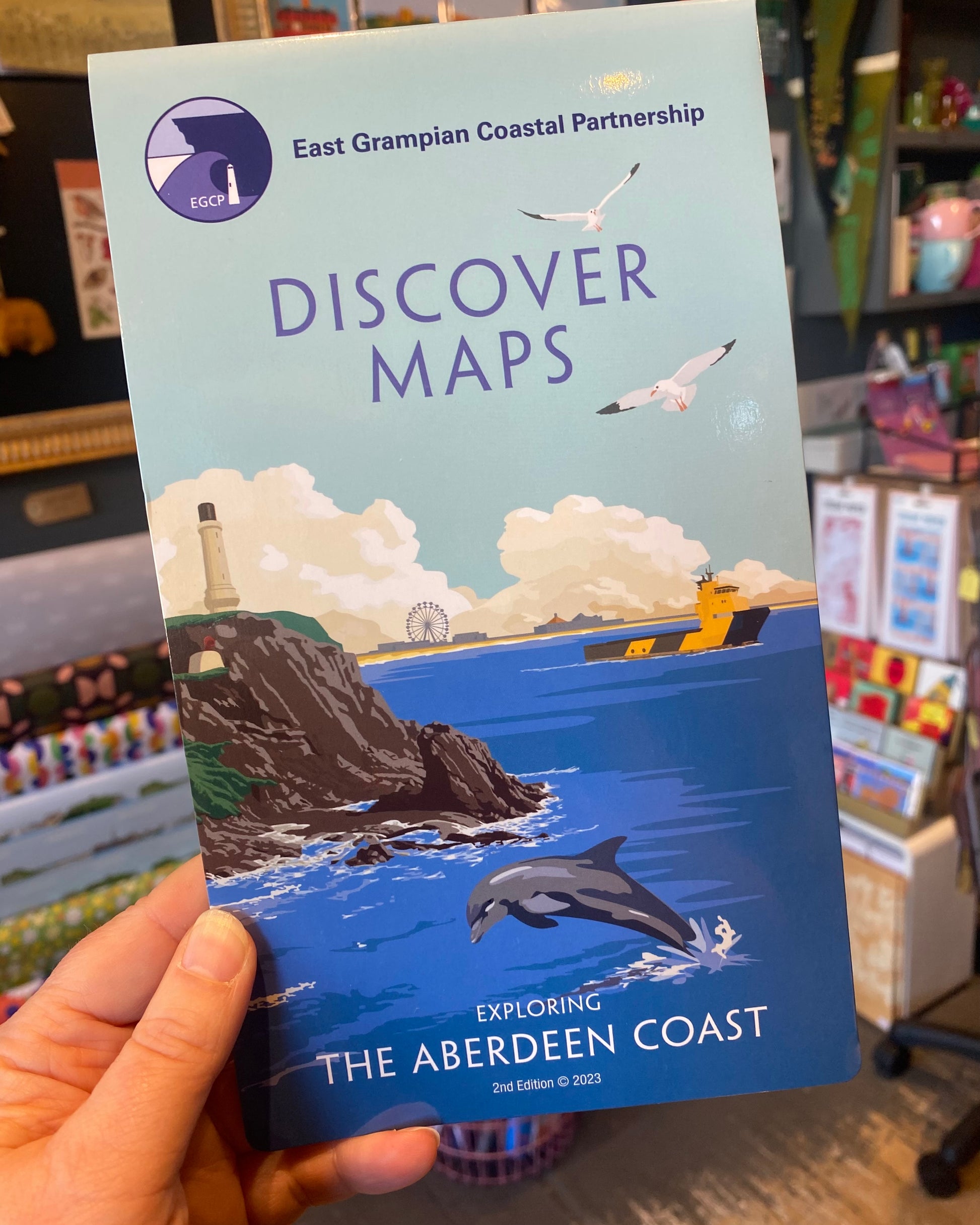 Aberdeen version of the East Grampian Coast Discover map held in a store setting