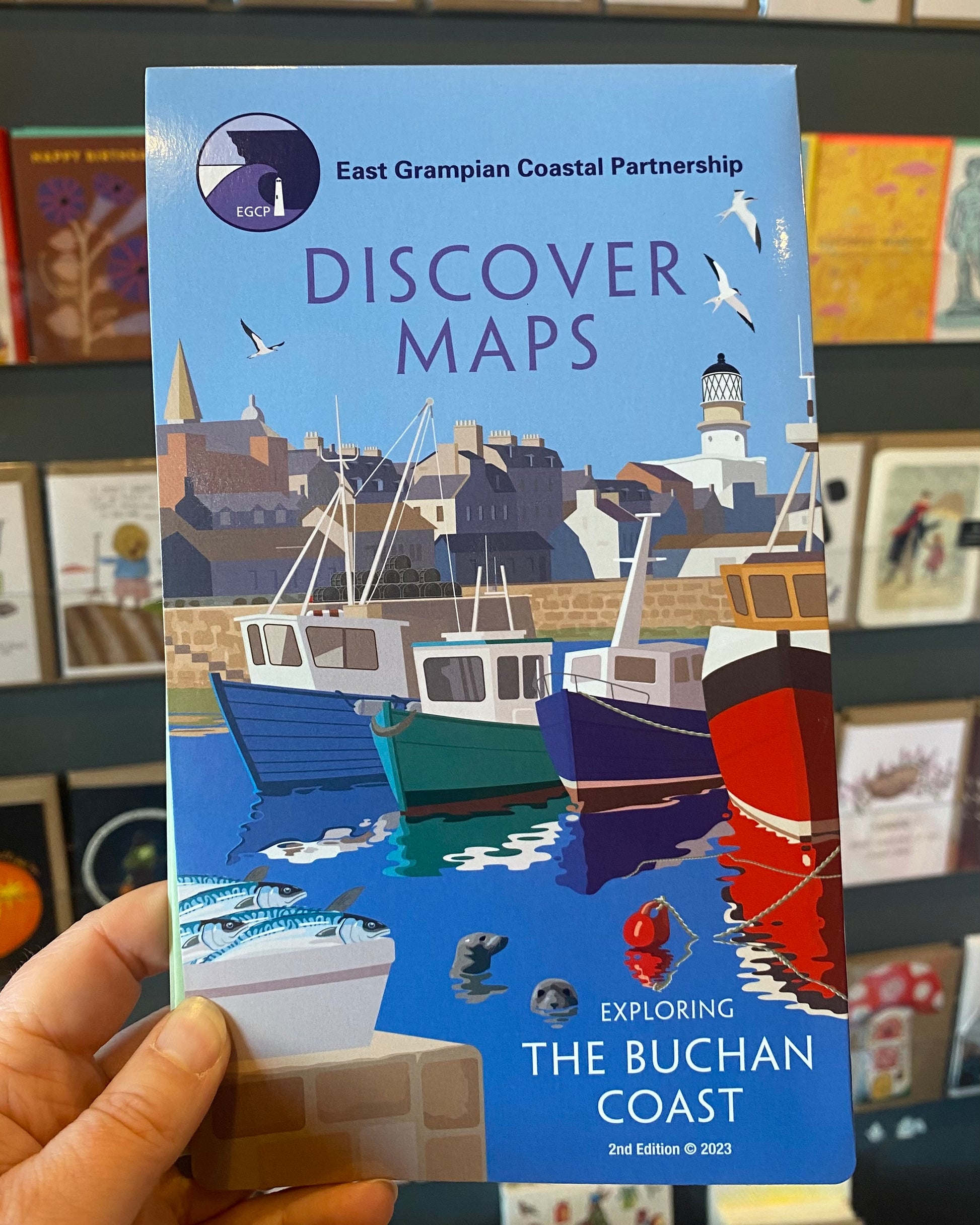 Buchan version of the East Grampian Coast Discover Map held in a store setting