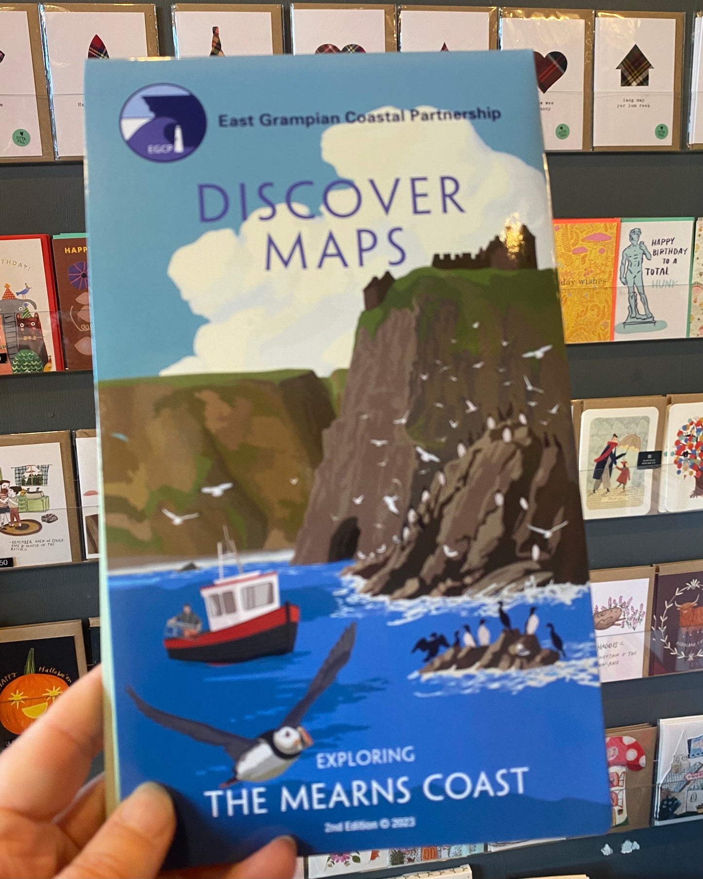 Mearns version of the East Grampian Coast Discover Map held in a store setting