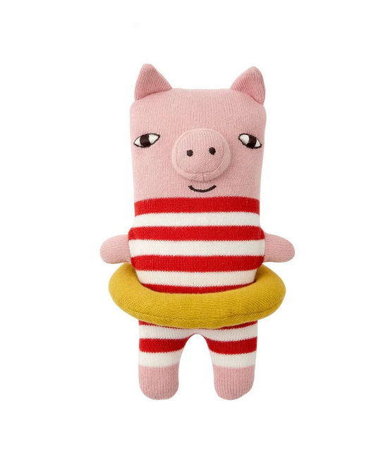 Pig soft toy with red striped swimming costume and yellow swimming ring, on a white background.