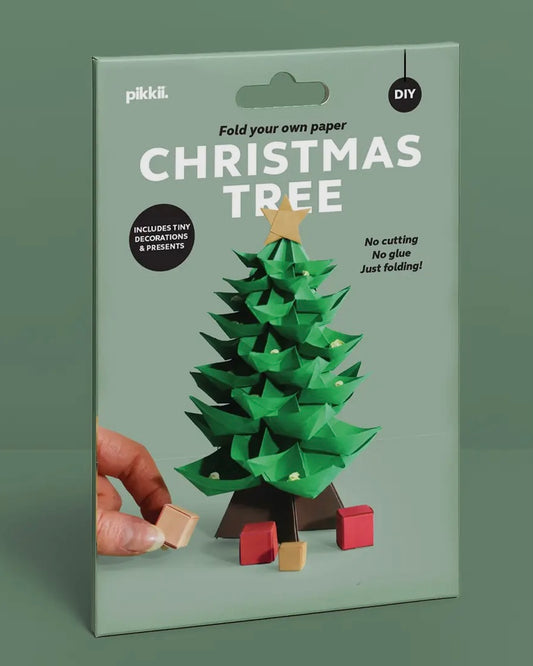 Pikkii DIY Christmas tree kit packaging on a green background