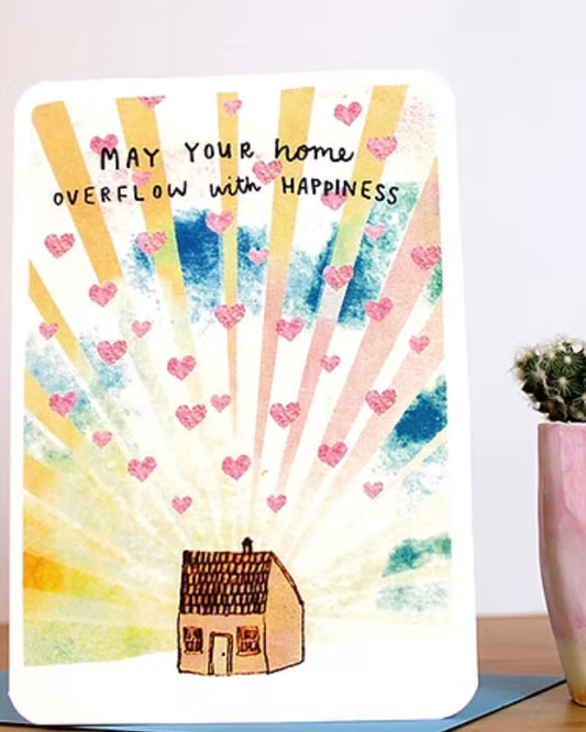 Card with a house illustration and text 'May your home overflow with happiness' on a colourful background.