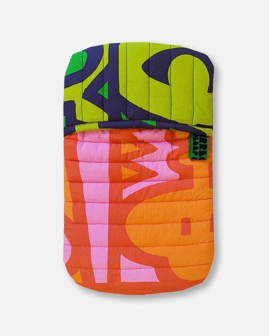 Colourful quilted hot water bottle cover with abstract pattern on a white background