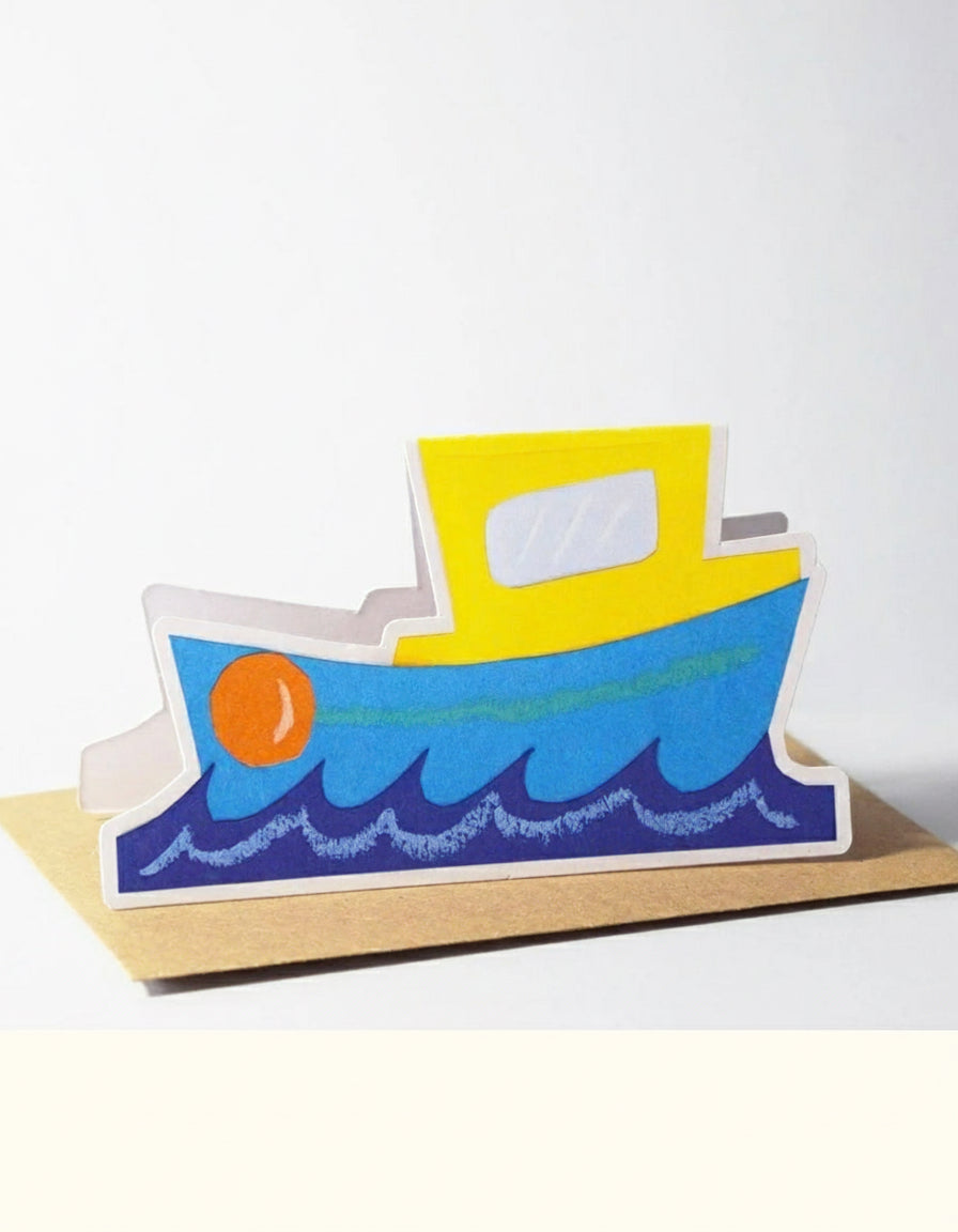 Colourful boat-shaped card on a white background