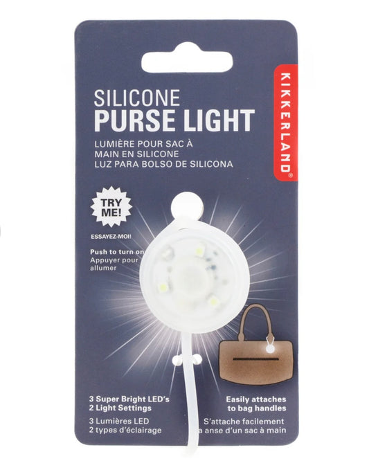 Silicone purse light on cardboard packaging with Kikkerland branding, on a white background