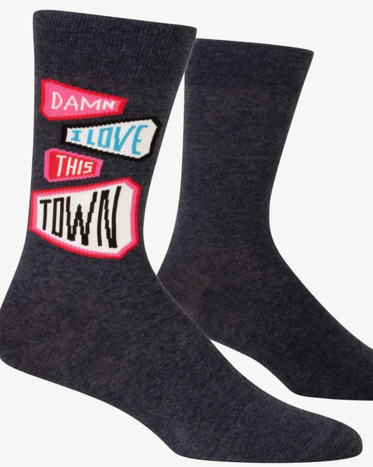 Dark grey socks with colourful text design Damn I Love This Town - on a white background