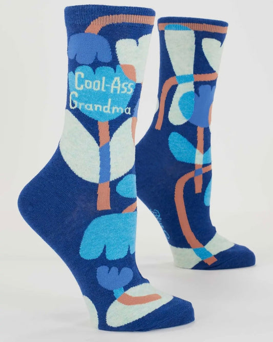Blue socks with abstract design and 'Cool-Ass Grandma' text on a white background
