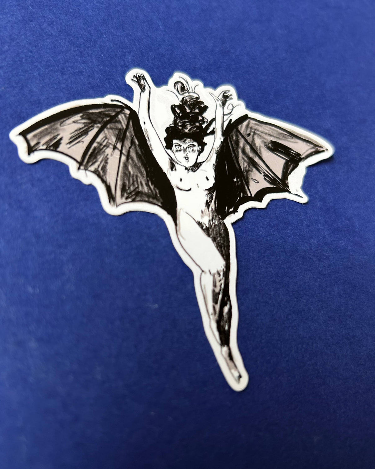 Stylized sticker of an illustration of a naked woman with bat-like wings and a top hat on a blue background