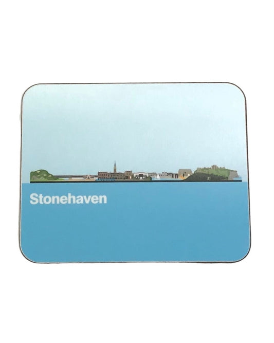 Rectangular coaster featuring a predominantly blue graphic illustration of Stonehaven’s skyline and the text ‘Stonehaven’ in white, on a white background. 